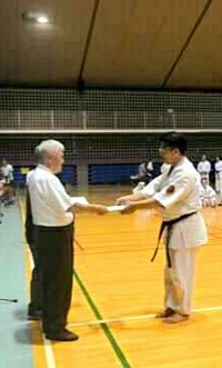 Receiving the 6th Dan certificate and authority to teach directly from the president of Okinawa Shorin Ryu Karatedo Kyokai